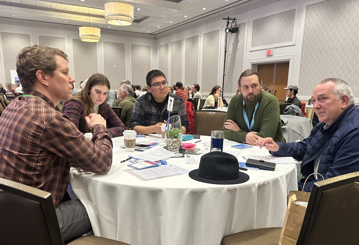 Attendees sitting together at the Environmental Flows Conference.