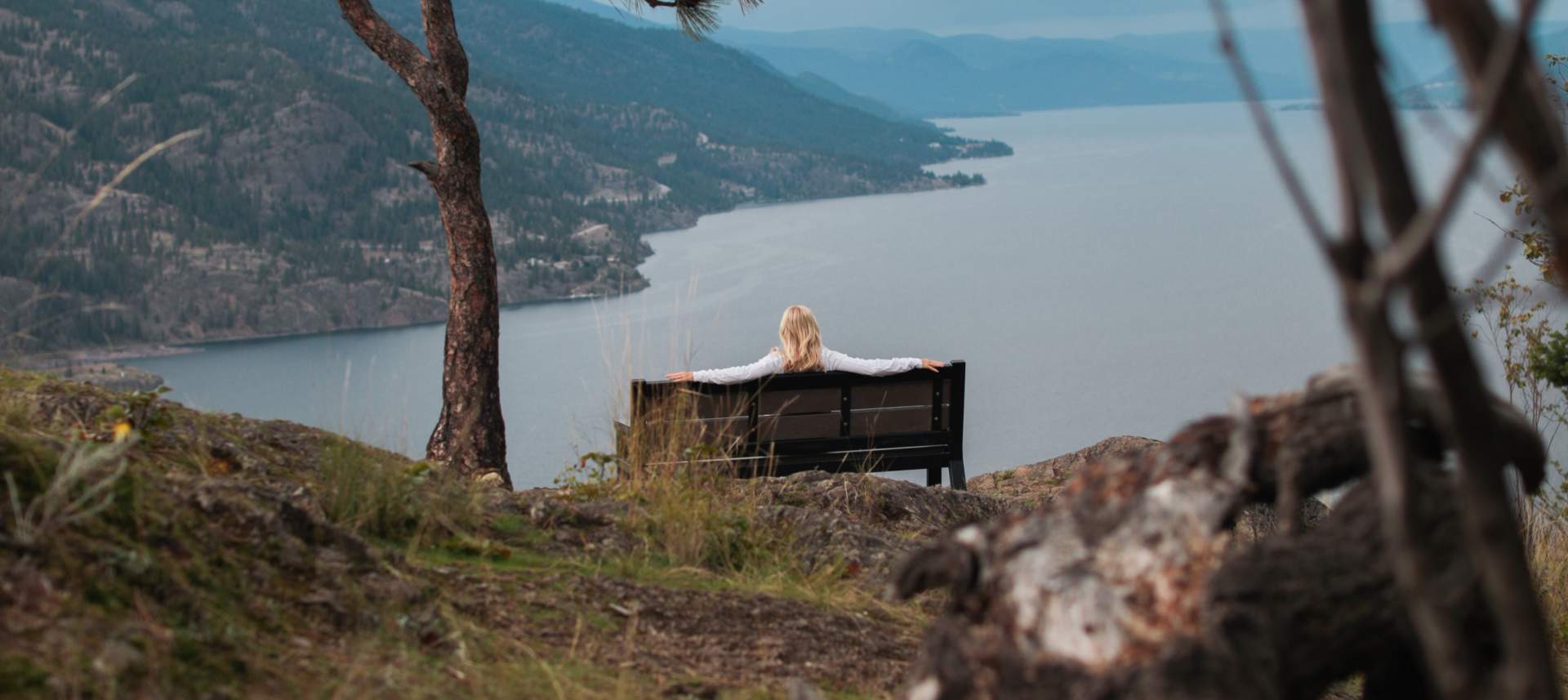 Conference attendee looking out at Okanagan Lake in Kelowna, B.C., near the conference accommodations.