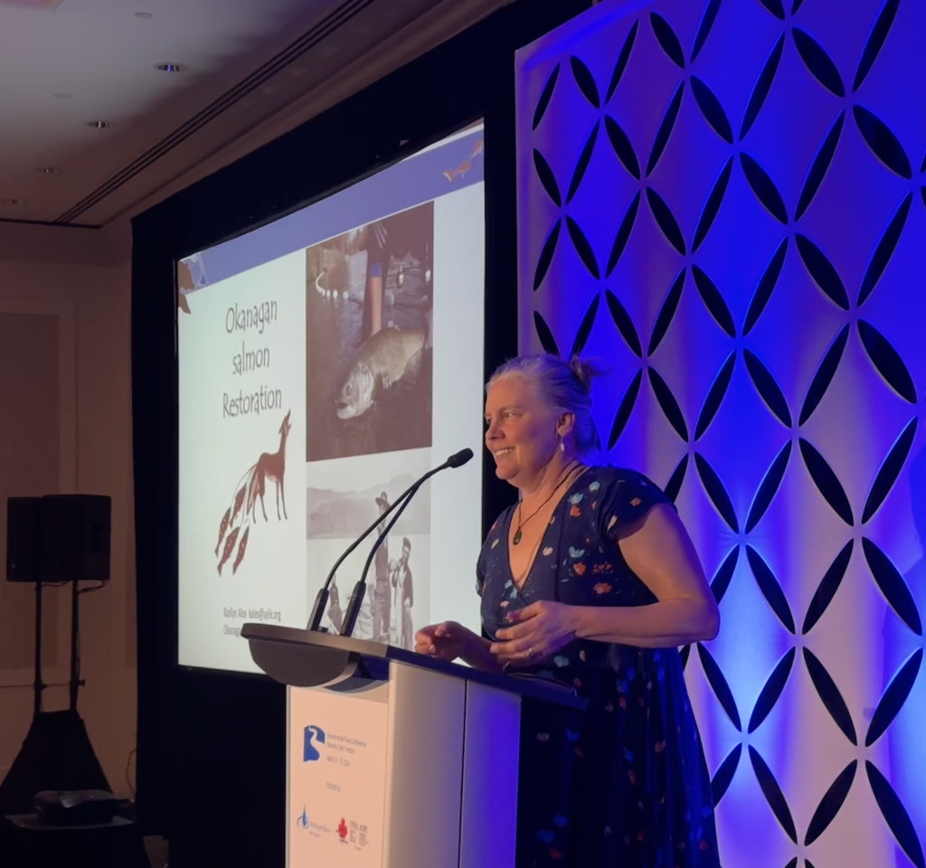 A keynote speaker presenting on fisheries management and river restoration frameworks during a previous Environmental Flows Conference in Kelowna, B.C.
